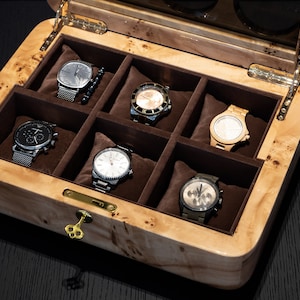 top view of mapa burl watch case, hinge, fabric and lock inside