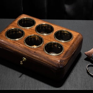top view of walnut watch organizer for 6 watch with brown pillow and lock