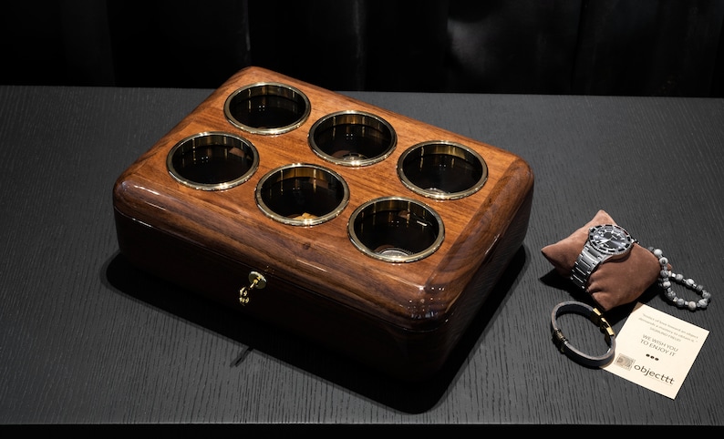 top view of walnut watch organizer for 6 watch with brown pillow and lock