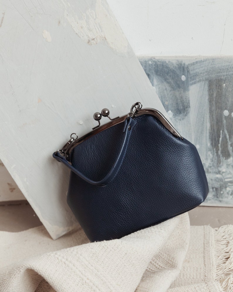 leather kiss lock handbag