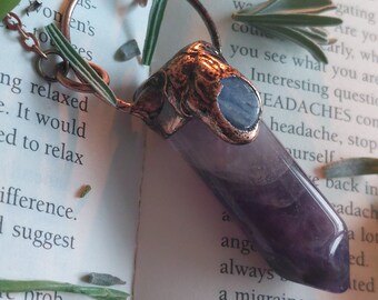 Handmade electroformed amethyst crystal pendant with kyanite crystal.