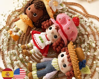May include: A collection of handmade crochet dolls in various outfits, including a yellow dress, a red and white dress, and a blue outfit. Each doll has a unique hat and is surrounded by white flowers.