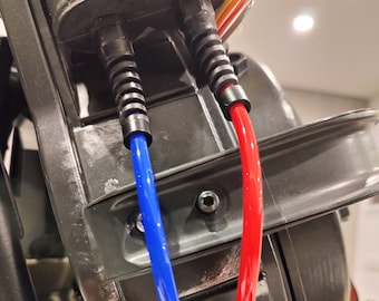 Conectores de prensaestopas para inyectores de protones de los Cazafantasmas con alivio de tensión