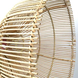 May include: A natural-toned, woven rattan lampshade with a rounded, open design. The shade features vertical and horizontal woven elements, creating a textured, airy appearance. The light brown color suggests a natural, eco-friendly aesthetic.