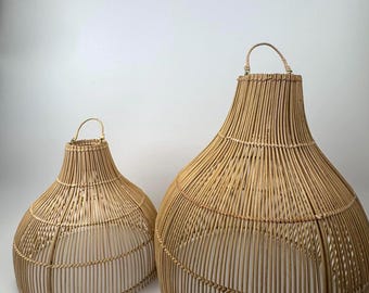 May include: Two woven rattan pendant light fixtures. The larger fixture is approximately 24 inches tall and 18 inches wide, while the smaller one is about 18 inches tall and 14 inches wide. Both have a teardrop shape and a handle at the top.