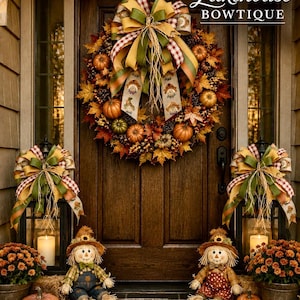 May include: A fall-themed front door display featuring a large wreath with autumn leaves, pinecones, and pumpkins, topped with a multi-colored ribbon. Two lanterns with bows, two scarecrow figures, potted orange mums, and pumpkins surround a welcome mat.
