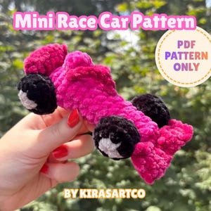May include: A crochet mini race car pattern featuring a bright pink yarn body with black and white wheels. The image includes the text Mini Race Car Pattern and PDF PATTERN ONLY, along with the brand name BY KIRASARTCO at the bottom.