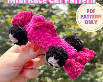 May include: A crochet mini race car pattern featuring a bright pink yarn body with black and white wheels. The image includes the text Mini Race Car Pattern and PDF PATTERN ONLY, along with the brand name BY KIRASARTCO at the bottom.