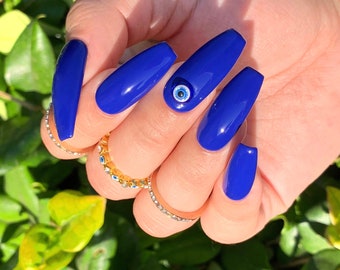 Sem energias negativas | Unhas com olho grego | Unhas postiças | Unhas de cola | Unhas de gel X