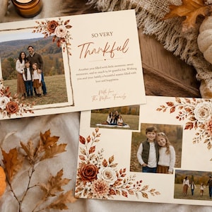 May include: Two rectangular cream-coloured cards featuring autumn-themed floral borders in shades of rust, orange, and white. The cards display family photographs, the text "SO VERY Thankful," and a printed message with a signature at the bottom.