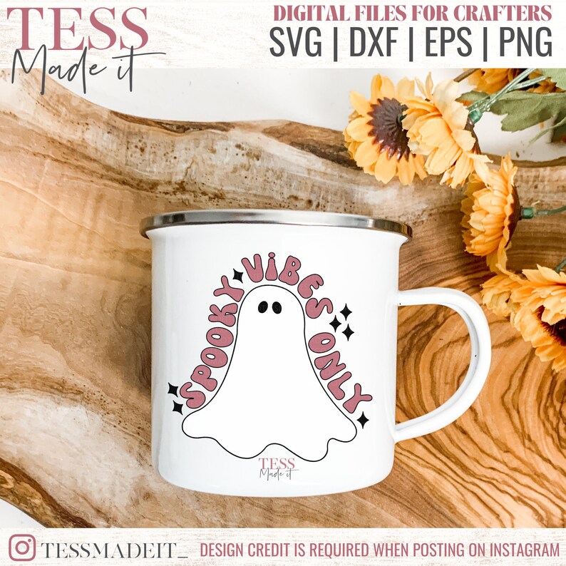 May include: White enamel mug with a pink and black design featuring a ghost and the text "Spooky Vibes Only".