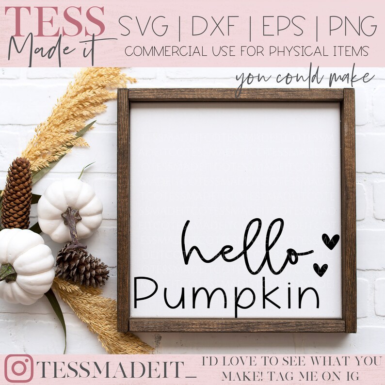 May include: A white wooden sign with a brown frame, featuring the text "hello pumpkin" in black cursive lettering with two small hearts.