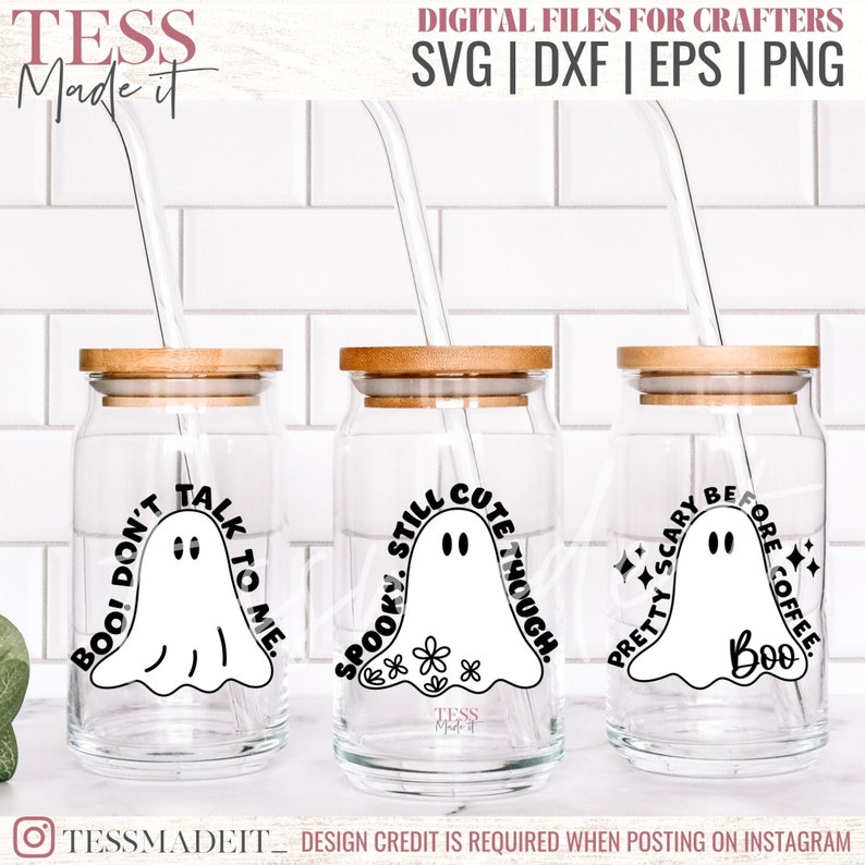 May include: Three glass jars with wooden lids and straws. Each jar has a different ghost design with text. The first jar says "Boo! Don't Talk To Me." The second jar says "Spooky Still Cute Though." The third jar says "Pretty Scary Before Coffee. Boo."