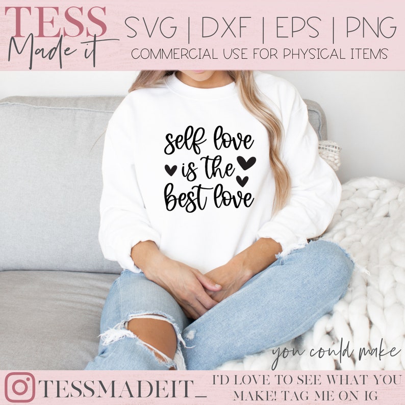 May include: White sweatshirt with the text "self love is the best love" in black lettering with four small black hearts. The sweatshirt is being worn by a person sitting on a couch.