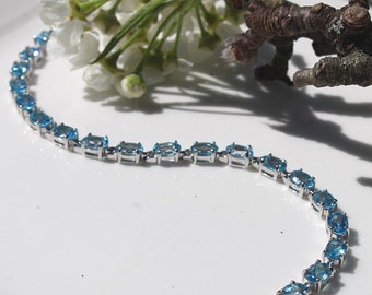 Silver Smile Sterling Silver 6x4mm Oval Cut 10.77 CTW Sky Blue Topaz Bracelet | Blue Topaz Tennis Bracelet for Women