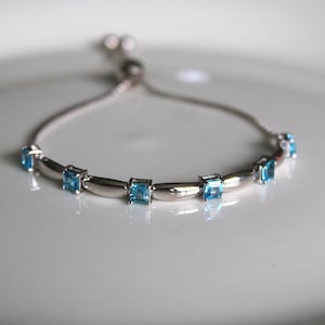 Sterling Silver Swiss Blue Bolo Bracelet: Adjustable Gemstone Jewelry