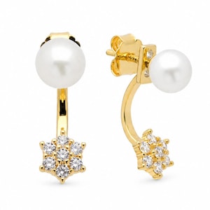 May include: A pair of gold-tone ear jackets featuring a white spherical pearl stud at the front and a curved gold bar extending downward to a flower-shaped cluster of clear, sparkling cubic zirconia stones that sits behind the earlobe.