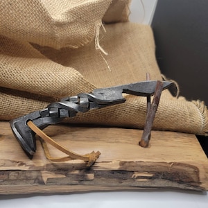 Cubic twist rail road spike bottle opener!