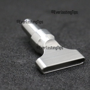 May include: A silver metal heat press tip with a rectangular opening. The tip is designed for use with a heat press machine.