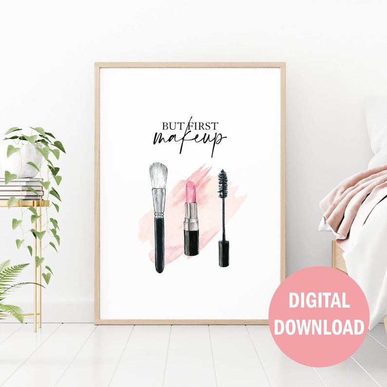 May include: A printable wall art design featuring a watercolor illustration of makeup brushes, lipstick, and mascara with the text "But first, makeup".