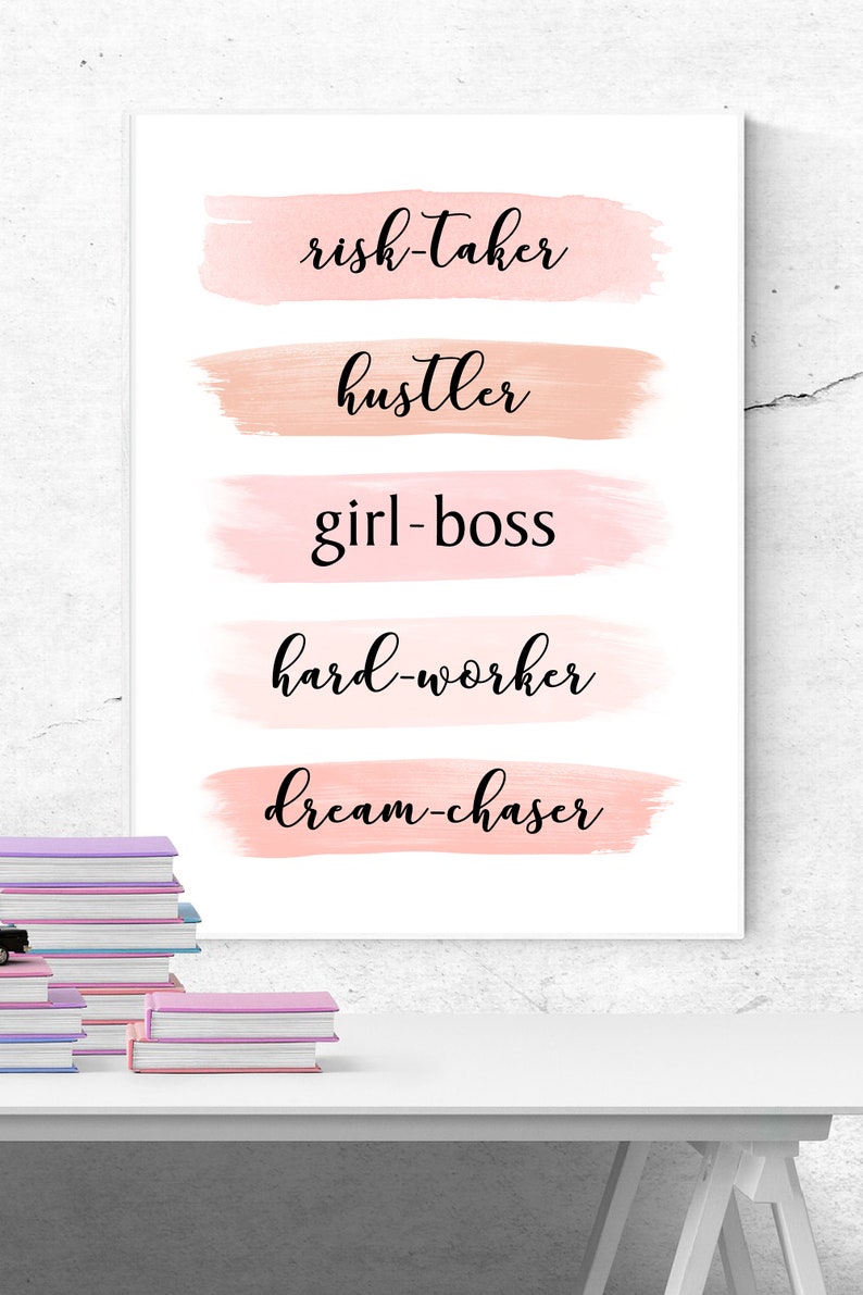 May include: A white poster with pink watercolor brushstrokes and the words "risk-taker", "hustler", "girl-boss", "hard-worker", and "dream-chaser" written in black cursive.