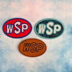 May include: Three embroidered patches with the letters "WSP" in white on different colored backgrounds. The patches are red, blue, and brown.