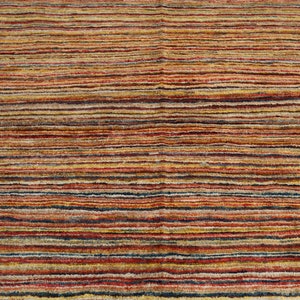 May include: Multicolored striped rug with a variety of shades of red, orange, yellow, brown, and blue.