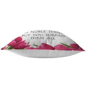 May include: White pillow with a pink tulip border and the text "Many noble things are done in this world, but you surpass them all."