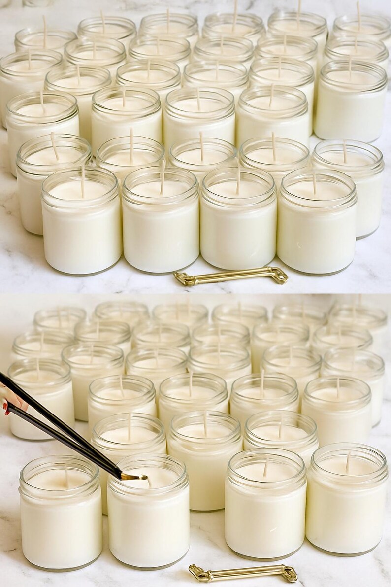 a collection of glass jars filled with white candles, arranged on a marble surface.