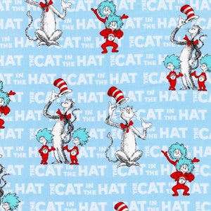May include: A blue fabric with a repeating pattern of the Cat in the Hat, Thing 1, and Thing 2. The characters are white and red with black outlines. The background is light blue with the words "The Cat in the Hat" repeated in white.
