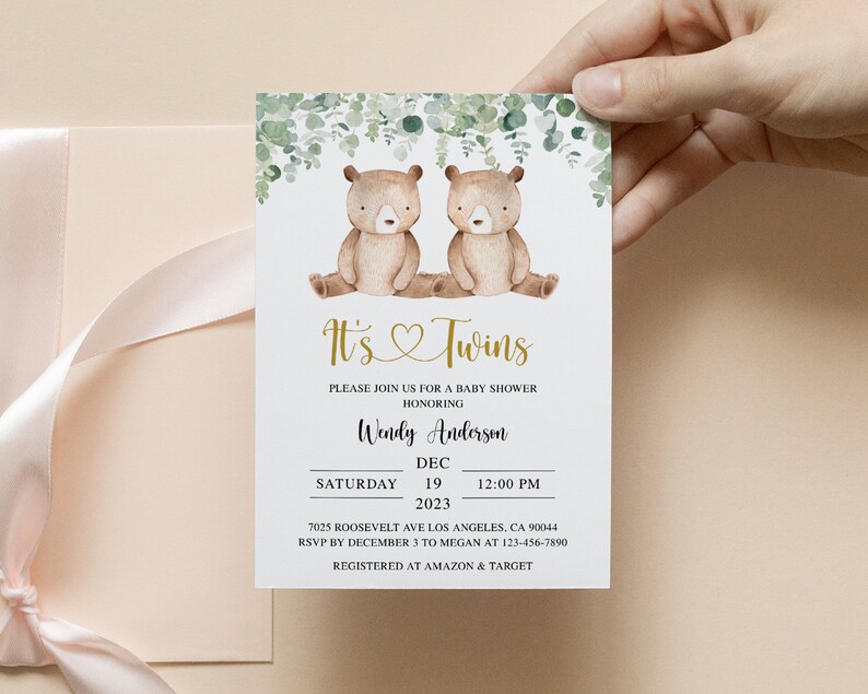 May include: It's Twins baby shower invitation with a watercolor illustration of two brown teddy bears sitting on a branch with green leaves. The invitation includes the date, time, and location of the shower, as well as the name of the honoree, Wendy Anderson. RSVP information and registry details are also included.