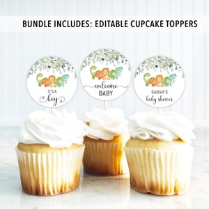 May include: Three round cupcake toppers with green foliage and dinosaurs. The toppers say "It's a boy", "Welcome Baby", and "Sarah's Baby Shower".