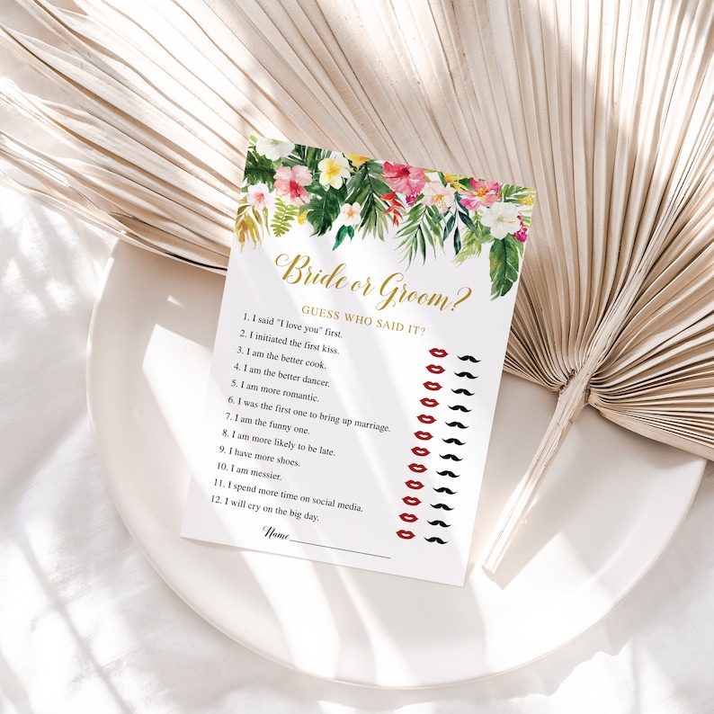 Peut inclure: Un jeu de douche nuptiale imprimable avec un motif floral tropical. Le jeu demande aux invit&eacute;s de deviner qui a dit quoi, avec une liste de 12 affirmations sur la mari&eacute;e et le mari&eacute;. Chaque affirmation est suivie d'une rang&eacute;e de l&egrave;vres rouges et de moustaches noires pour que les invit&eacute;s puissent marquer leurs devinettes.