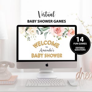 May include: A computer screen displaying a virtual baby shower game with a floral design and the text "Welcome to Amanda's Baby Shower". The screen is on a desk with a keyboard and mouse. There is a 14 fun games editable questions circle in the top right corner of the screen.
