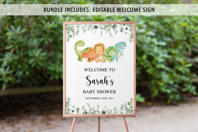 May include: A welcome sign for a baby shower with a green, white, and brown color scheme. The sign features a group of cartoon dinosaurs with a leafy border. The text on the sign reads "Welcome to Sarah's Baby Shower December 16th, 2023".