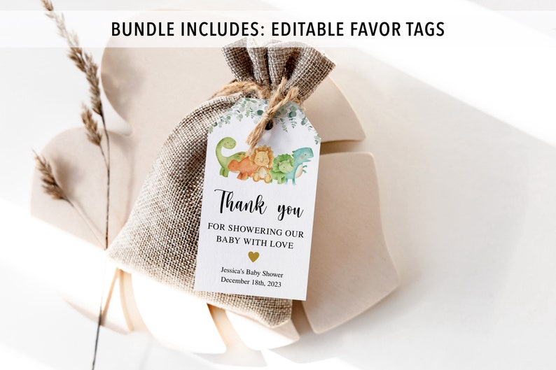 May include: A white favor tag with a green, orange, and yellow dinosaur illustration. The tag says "Thank you for showering our baby with love" and includes the date "December 18th, 2023".