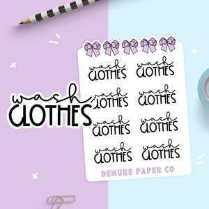 May include: A sheet of stickers with the text "wash clothes" repeated eight times. Each sticker features a purple bow. The bottom sticker has the text "DEMURE PAPER CO".