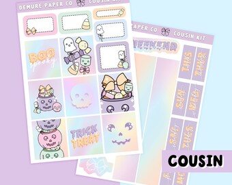 May include: A set of Halloween themed planner stickers with a pastel rainbow background. The stickers feature ghosts, candy corn, pumpkins, skulls, and the words "Boo spooky", "Trick Treat", and "Weekend".