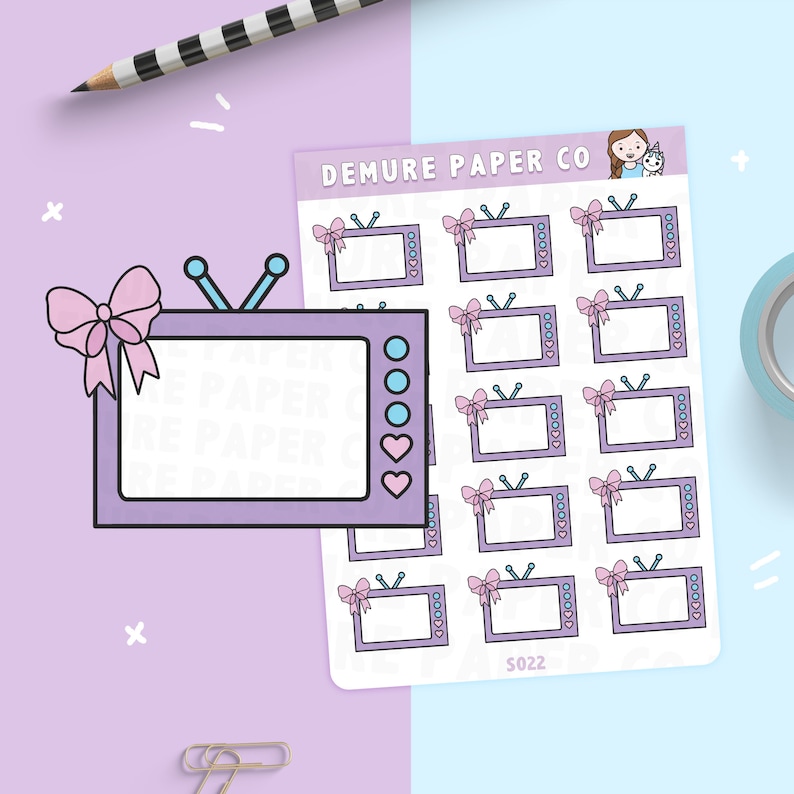 May include: A sheet of stickers featuring a cartoon television with a pink bow and a heart. The stickers are on a light blue background with the text "DEMURE PAPER CO" and "S022".