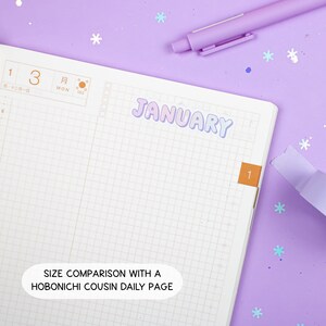 May include: A close-up of a blank daily planner page with a January sticker and the text "SIZE COMPARISON WITH A HOBONICHI COUSIN DAILY PAGE". The planner page is gridded and has a light purple background.