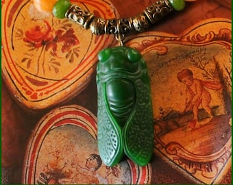 Necklace (45cm) green jade cicada (4cm), green and orange jade beads and bronze beads.