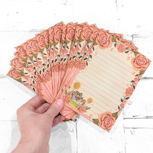 May include: A set of three ceramic mugs with a speckled, matte finish. The mugs are in shades of cream, light gray, and dark gray. Each mug has a simple, minimalist design, perfect for coffee or tea.