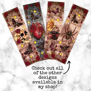 May include: Four different bookmark designs with a vintage aesthetic. Each bookmark features a different illustration: a skull, a heart, a gramophone, and a spider. The bookmarks have a brown background with red roses and gold stars.
