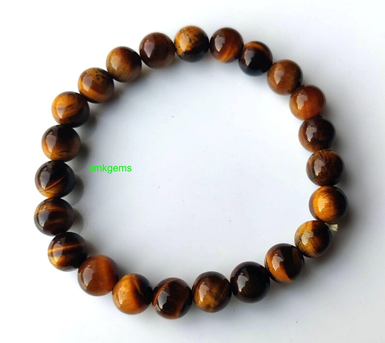 Handmade Tiger Eye stretch bracelet shown on hand