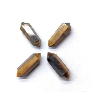Golden brown natural Tiger Eye gemstones with visible chatoyancy and natural color variation