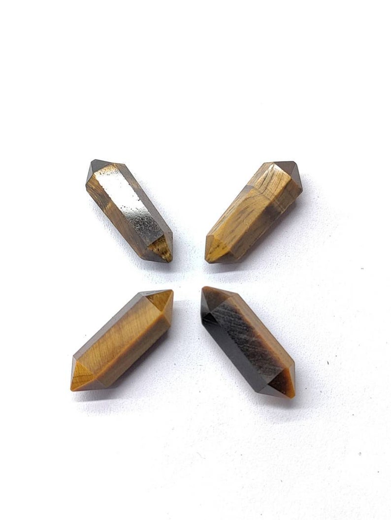 Golden brown natural Tiger Eye gemstones with visible chatoyancy and natural color variation