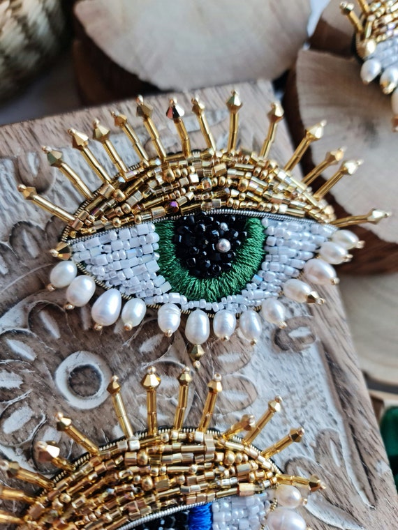 Eye brooch deals
