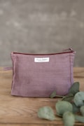 Handmade Pastel Plum Linen Makeup Bag: Zippered Toiletry Pouch product logo