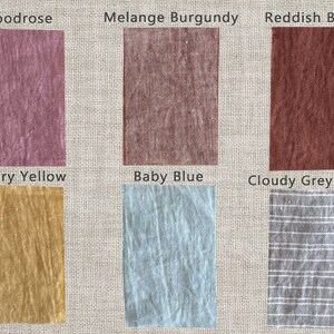May include: Six fabric swatches in different colors and patterns. The swatches are labeled "Woodrose", "Melange Burgundy", "Reddish Brown", "Canary Yellow", "Baby Blue", and "Cloudy Grey Stripe".