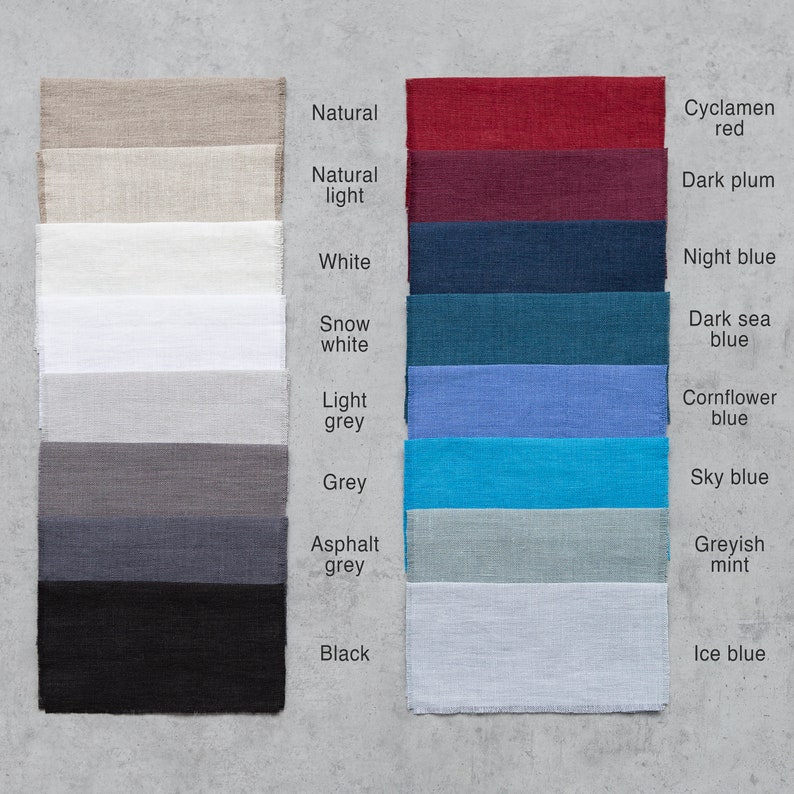 May include: A color chart of fabric swatches in various shades of white, grey, blue, and red. The swatches are labeled with names like "Natural", "Natural light", "White", "Snow white", "Light grey", "Grey", "Asphalt grey", "Black", "Cyclamen red", "Dark plum", "Night blue", "Dark sea blue", "Cornflower blue", "Sky blue", "Greyish mint", and "Ice blue".